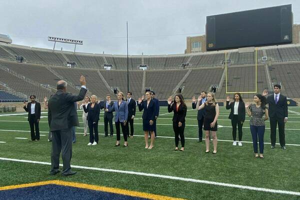 Fall 2023 Digital Forensics Investigators are sworn in on the Notre Dame football field.