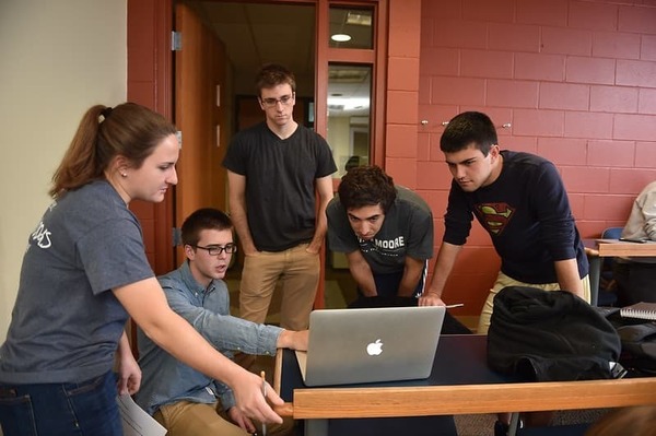Five Students Looking At Computer