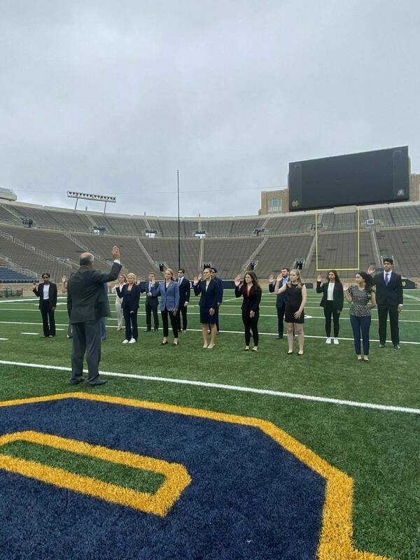 Fall 2023 Digital Forensics Investigators are sworn in on the Notre Dame football field.